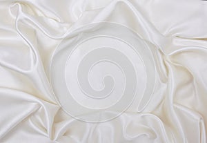 Smooth elegant white silk or satin luxury cloth texture as wedding background. Luxurious Christmas background or New Year