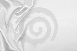 Smooth elegant white silk or satin luxury cloth texture as wedding background. Luxurious Christmas background or New Year