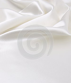 Smooth elegant white silk or satin luxury cloth texture as wedding background. Luxurious Christmas background or New Year