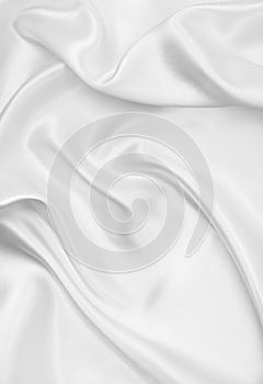 Smooth elegant white silk or satin luxury cloth texture as wedding background. Luxurious Christmas background or New Year