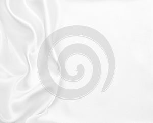 Smooth elegant white silk or satin luxury cloth texture as wedding background. Luxurious Christmas background or New Year