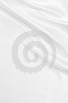 Smooth elegant white silk or satin luxury cloth texture as wedding background. Luxurious Christmas background or New Year