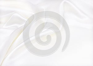 Smooth elegant white silk or satin luxury cloth texture as wedding background. Luxurious Christmas background or New Year