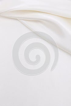 Smooth elegant white silk or satin luxury cloth texture as wedding background. Luxurious background design