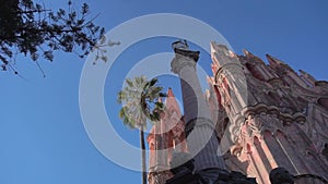 Smooth Gimbal Footage of great Parroquia de San Miguel Arcangel pink sandstone church in San Miguel de Allende, Mexico