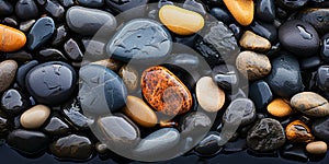 The smooth, glossy texture of a river rock, with waterworn pebbles polished to a high shi