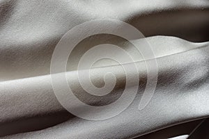 Smooth grey chiffon fabric in soft folds