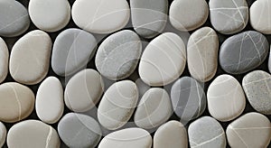Smooth grey and white beach pebbles with natural lines in a seamless pattern