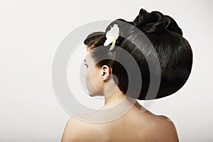 Smooth Healthy Black Hair with Flower. Spa Salon photo