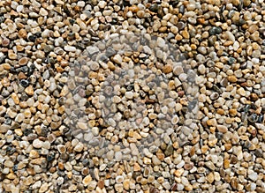 Smooth layer of tiny pebbles seen from above. Background surface