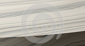 Smooth marble surface with horizontal, undulating gray and white veining patterns.