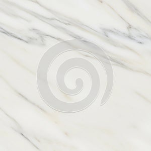 Smooth marble surface with a white base, featuring subtle grey and beige veining. The pattern is