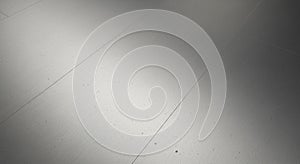 Smooth metallic surface with visible horizontal seams and light reflections. The