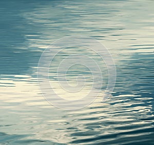 Smooth natural water background sun light on the sea or ocean,vintage and soft colored background water ripple background