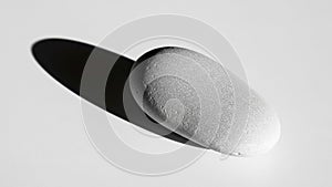 Casts a soft shadow to the right suggesting a light source from the