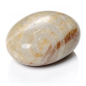 Smooth river stone with polished surface isolated on white background photo