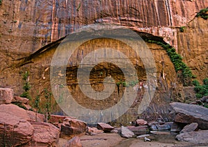 A smooth rock face discoloured by water