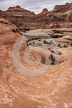 Smooth Rock Trail Funnels Down To The Top of A Ladder