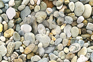 Smooth round pebbles sea texture background. Pebble on a beach.