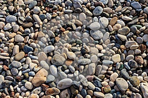 Smooth round pebbles texture background. Pebble sea beach