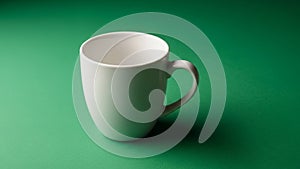 A smooth rounded shape and a sturdy handle. Its surface is glossy