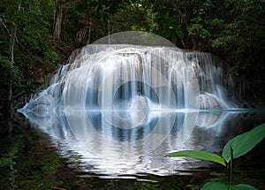 Smooth and silky beautiful waterfall with reflection in water