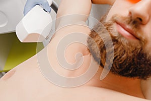 Smooth skin man under arms. Laser hair removal.