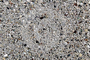 Smooth surface of an artificial conglomerate rock concrete wall