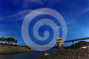 Smooth surface of the lake on a background the starry sky