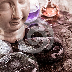 Smooth Wet Rocks, Buddha Head and Essential Oils