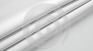 Smooth white fabric with gentle folds and subtle shadows creates a clean and