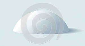 A smooth, white, hemispherical object sits