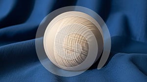 Soft lighting highlights the curvature and texture of the sphere casting