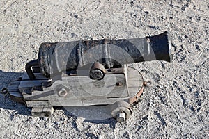 Smoothbore guns - firearms on a sand background.