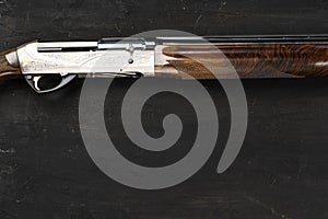 Smoothbore hunting gun on black background close up