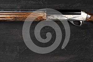 Smoothbore hunting gun on black background close up