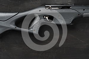 Smoothbore hunting gun on black background close up
