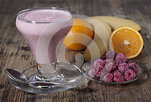 Smoothie of banana, orange juice , frozen raspberry with yogur