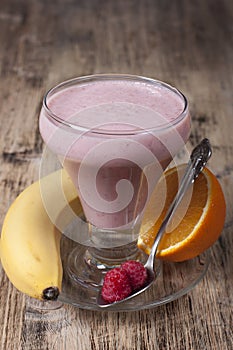 Smoothie of banana, orange juice , frozen raspberry with yogur