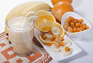 Smoothie of banana, orange juice , frozen sea-buckthorn with y