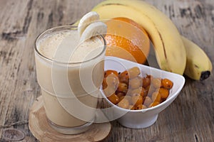 Smoothie of banana, orange juice , frozen sea-buckthorn with y