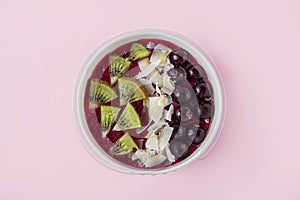 Smoothie bowl with acai, banana, blueberries, kiwi fruit and black currants. Healthy super food with fresh fruit. Vegetarian and