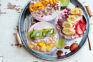 Smoothie bowls with tropical fruits