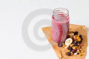 Smoothie of freeze-dried cherry, banana, apple, blueberry in a highball glass photo