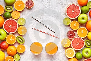 Smoothie or fresh juice vitamin drink in citrus fruits background flat lay, helthy vegetarian organic antioxidant detox