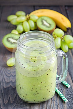Smoothie with kiwi, green grape, and banana in glass jar