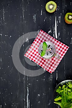 Smoothie with kiwi and spinach. Top view. Food background