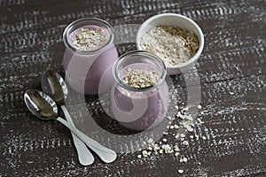 Smoothie with strawberries and oat flakes in a glass jar