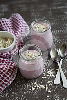 Smoothie with strawberries and oat flakes in a glass jar