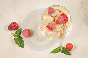 Smoothies with corn flakes decorated mint and strawberry/Smoothies with corn flakes decorated mint and strawberry on white table.